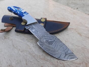 Custom handmade Damascus steel hunting tracker knife with blue resin sheet handle and leather sheath